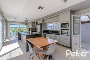 Casa em Condomínio à venda com 270m², 3 dormitórios, 2 suítes, 3 vagas, no bairro Terra Ville em PORTO ALEGRE