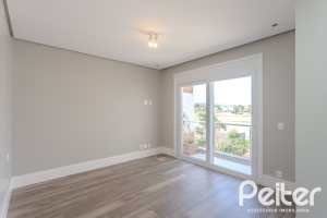 Casa em Condomínio à venda com 270m², 3 dormitórios, 2 suítes, 3 vagas, no bairro Terra Ville em PORTO ALEGRE