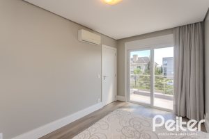 Casa em Condomínio à venda com 270m², 3 dormitórios, 2 suítes, 3 vagas, no bairro Terra Ville em PORTO ALEGRE