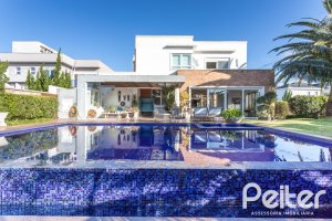 Casa em Condomínio à venda com 510m², 4 dormitórios, 4 suítes, 6 vagas, no bairro Terra Ville em PORTO ALEGRE
