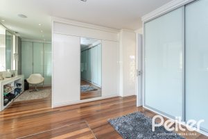 Casa em Condomínio à venda com 510m², 4 dormitórios, 4 suítes, 6 vagas, no bairro Terra Ville em PORTO ALEGRE