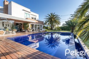 Casa em Condomínio à venda com 510m², 4 dormitórios, 4 suítes, 6 vagas, no bairro Terra Ville em PORTO ALEGRE