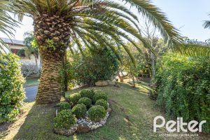 Casa em Condomínio à venda com 510m², 4 dormitórios, 4 suítes, 6 vagas, no bairro Terra Ville em PORTO ALEGRE