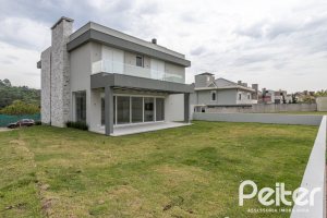 Casa em Condomínio à venda com 331m², 3 dormitórios, 3 suítes, 2 vagas, no bairro Alphaville em PORTO ALEGRE