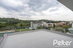 Casa em Condomínio à venda com 331m², 3 dormitórios, 3 suítes, 2 vagas, no bairro Alphaville em PORTO ALEGRE