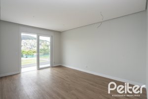 Casa em Condomínio à venda com 331m², 3 dormitórios, 3 suítes, 2 vagas, no bairro Alphaville em PORTO ALEGRE