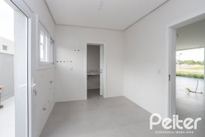 Casa em Condomínio à venda com 331m², 3 dormitórios, 3 suítes, 2 vagas, no bairro Alphaville em PORTO ALEGRE