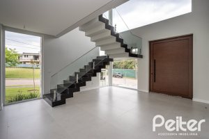 Casa em Condomínio à venda com 331m², 3 dormitórios, 3 suítes, 2 vagas, no bairro Alphaville em PORTO ALEGRE