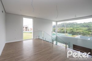 Casa em Condomínio à venda com 331m², 3 dormitórios, 3 suítes, 2 vagas, no bairro Alphaville em PORTO ALEGRE