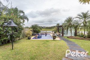 Casa em Condomínio à venda com 592m², 3 dormitórios, 3 suítes, 4 vagas, no bairro Terra Ville em PORTO ALEGRE