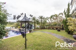 Casa em Condomínio à venda com 592m², 3 dormitórios, 3 suítes, 4 vagas, no bairro Terra Ville em PORTO ALEGRE