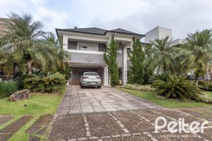 Casa em Condomínio à venda com 592m², 3 dormitórios, 3 suítes, 4 vagas, no bairro Terra Ville em PORTO ALEGRE