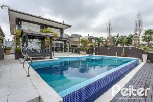 Casa em Condomínio à venda com 506m², 4 dormitórios, 4 suítes, 4 vagas, no bairro Terra Ville em Porto Alegre