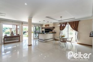 Casa em Condomínio à venda com 386m², 4 dormitórios, 4 suítes, 4 vagas, no bairro Terra Ville em PORTO ALEGRE