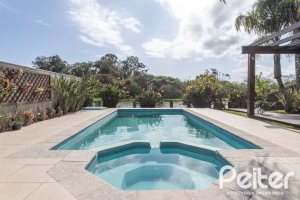 Casa em Condomínio à venda com 386m², 4 dormitórios, 4 suítes, 4 vagas, no bairro Terra Ville em PORTO ALEGRE