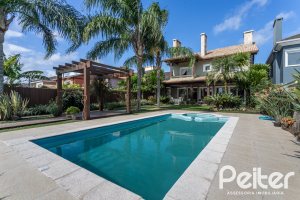 Casa em Condomínio à venda com 386m², 4 dormitórios, 4 suítes, 4 vagas, no bairro Terra Ville em PORTO ALEGRE