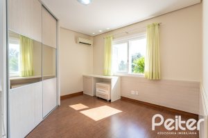 Casa em Condomínio à venda com 386m², 4 dormitórios, 4 suítes, 4 vagas, no bairro Terra Ville em PORTO ALEGRE