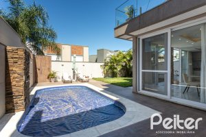 Casa em Condomínio à venda com 312m², 4 dormitórios, 4 suítes, 4 vagas, no bairro Hipica em PORTO ALEGRE