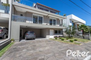 Casa em Condomínio à venda com 312m², 4 dormitórios, 4 suítes, 4 vagas, no bairro Hipica em PORTO ALEGRE