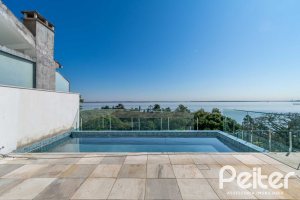 Casa à venda com 450m², 3 dormitórios, 3 suítes, 6 vagas, no bairro Vila Assunção em Porto Alegre