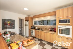 Casa em Condomínio à venda com 276m², 2 dormitórios, 2 suítes, 2 vagas, no bairro Terra Ville em PORTO ALEGRE