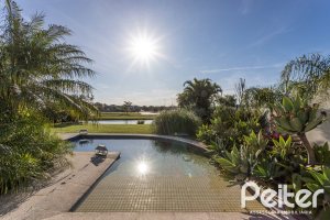 Casa em Condomínio à venda com 276m², 2 dormitórios, 2 suítes, 2 vagas, no bairro Terra Ville em PORTO ALEGRE