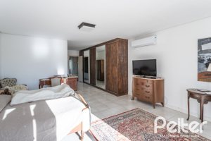 Casa em Condomínio à venda com 276m², 2 dormitórios, 2 suítes, 2 vagas, no bairro Terra Ville em PORTO ALEGRE