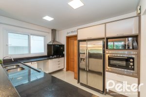 Casa em Condomínio à venda com 333m², 3 dormitórios, 3 suítes, 4 vagas, no bairro Terra Ville em PORTO ALEGRE