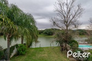 Casa em Condomínio à venda com 333m², 3 dormitórios, 3 suítes, 4 vagas, no bairro Terra Ville em PORTO ALEGRE