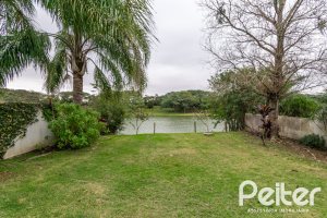 Casa em Condomínio à venda com 333m², 3 dormitórios, 3 suítes, 4 vagas, no bairro Terra Ville em PORTO ALEGRE