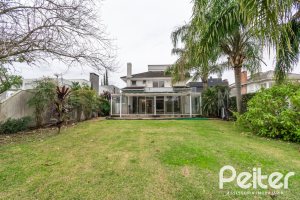 Casa em Condomínio à venda com 333m², 3 dormitórios, 3 suítes, 4 vagas, no bairro Terra Ville em PORTO ALEGRE