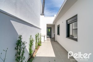 Casa em Condomínio à venda com 93m², 3 dormitórios, 1 suíte, 2 vagas, no bairro Hípica em Porto Alegre