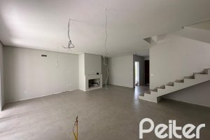 Casa em Condomínio à venda com 266m², 3 dormitórios, 3 suítes, 2 vagas, no bairro Hipica em PORTO ALEGRE