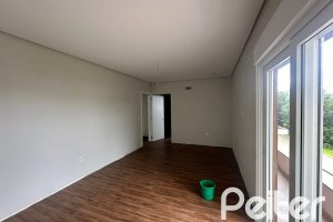 Casa em Condomínio à venda com 266m², 3 dormitórios, 3 suítes, 2 vagas, no bairro Hipica em PORTO ALEGRE