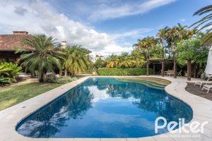 Casa em Condomínio à venda com 290m², 3 dormitórios, 3 suítes, 4 vagas, no bairro Terra Ville em PORTO ALEGRE