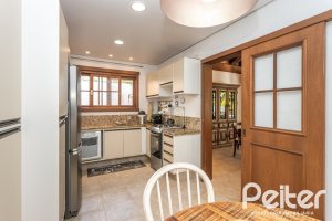 Casa em Condomínio à venda com 290m², 3 dormitórios, 3 suítes, 4 vagas, no bairro Terra Ville em PORTO ALEGRE