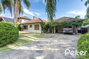 Casa em Condomínio à venda com 290m², 3 dormitórios, 3 suítes, 4 vagas, no bairro Terra Ville em PORTO ALEGRE