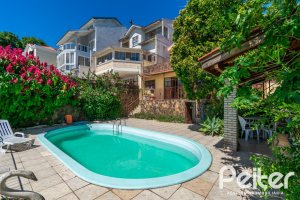 Casa à venda com 305m², 4 dormitórios, 2 suítes, 2 vagas, no bairro Sétimo Céu em Porto Alegre