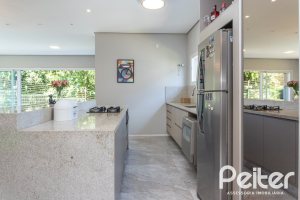 Casa em Condomínio à venda com 248m², 3 dormitórios, 2 suítes, 2 vagas, no bairro Alphaville em PORTO ALEGRE