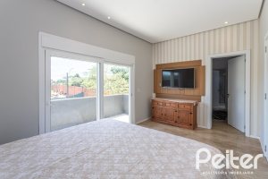 Casa em Condomínio à venda com 248m², 3 dormitórios, 2 suítes, 2 vagas, no bairro Alphaville em PORTO ALEGRE