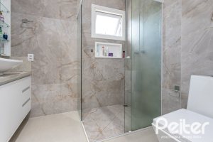 Casa em Condomínio à venda com 248m², 3 dormitórios, 2 suítes, 2 vagas, no bairro Alphaville em PORTO ALEGRE