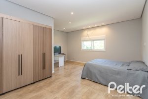 Casa em Condomínio à venda com 248m², 3 dormitórios, 2 suítes, 2 vagas, no bairro Alphaville em PORTO ALEGRE