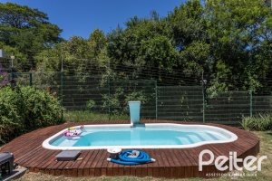 Casa em Condomínio à venda com 248m², 3 dormitórios, 2 suítes, 2 vagas, no bairro Alphaville em PORTO ALEGRE