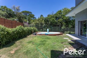 Casa em Condomínio à venda com 248m², 3 dormitórios, 2 suítes, 2 vagas, no bairro Alphaville em PORTO ALEGRE