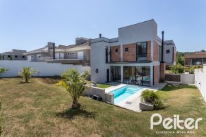 Casa em Condomínio à venda com 263m², 4 dormitórios, 4 suítes, 2 vagas, no bairro Alphaville em PORTO ALEGRE