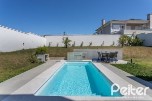 Casa em Condomínio à venda com 263m², 4 dormitórios, 4 suítes, 2 vagas, no bairro Alphaville em PORTO ALEGRE