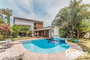 Casa em Condomínio à venda com 435m², 4 dormitórios, 3 suítes, 4 vagas, no bairro Terra Ville em PORTO ALEGRE