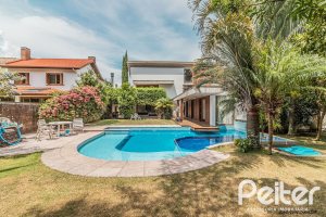 Casa em Condomínio à venda com 435m², 4 dormitórios, 3 suítes, 4 vagas, no bairro Terra Ville em PORTO ALEGRE