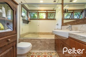 Casa em Condomínio à venda com 282m², 3 dormitórios, 1 suíte, 3 vagas, no bairro Cavalhada em PORTO ALEGRE