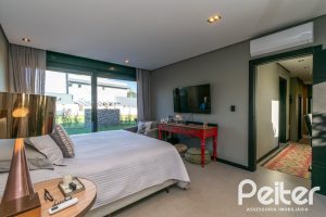 Casa em Condomínio à venda com 260m², 3 dormitórios, 3 suítes, 4 vagas, no bairro Alphaville em PORTO ALEGRE